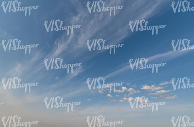 daytime sky with thin long clouds