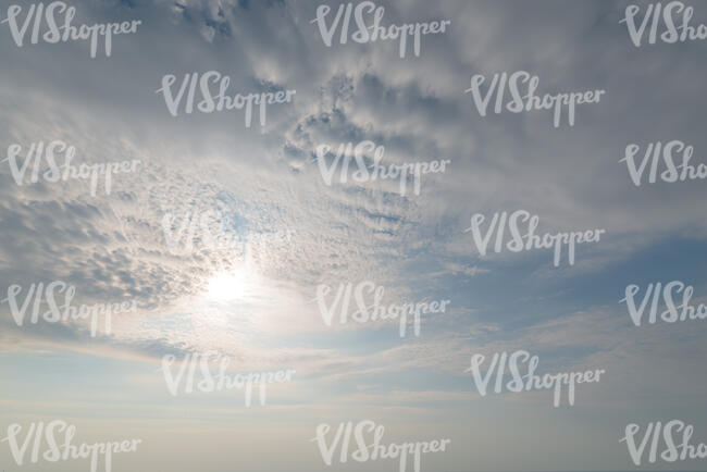 daytime sky covered with thin layer of white clouds