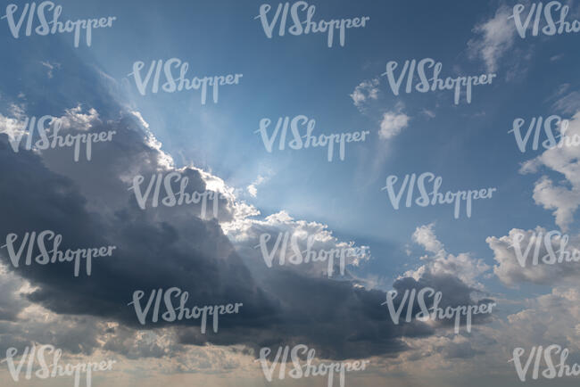 daytime sky with a dark cloud