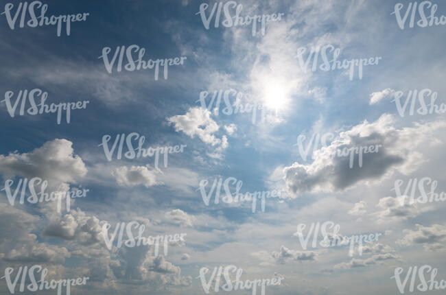 daytime sky with clouds and sun