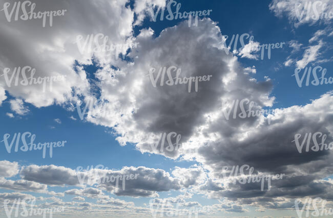 daytime sky partly covered with grey clouds