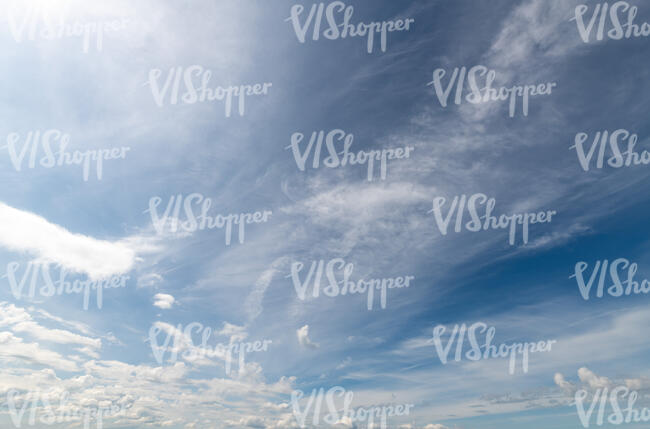 daytime sky with thin white clouds