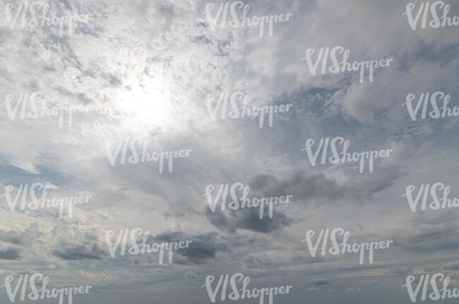 sky with sun covered with thin clouds