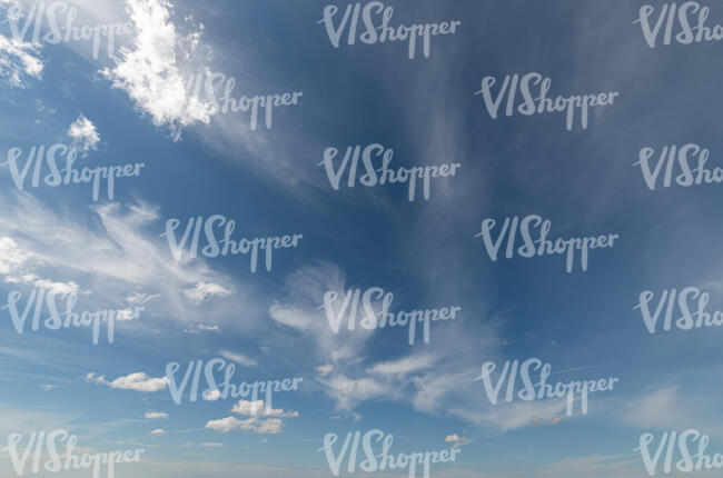 deep blue sky with tiny white clouds