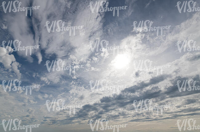 sky with sun and mixed type of clouds