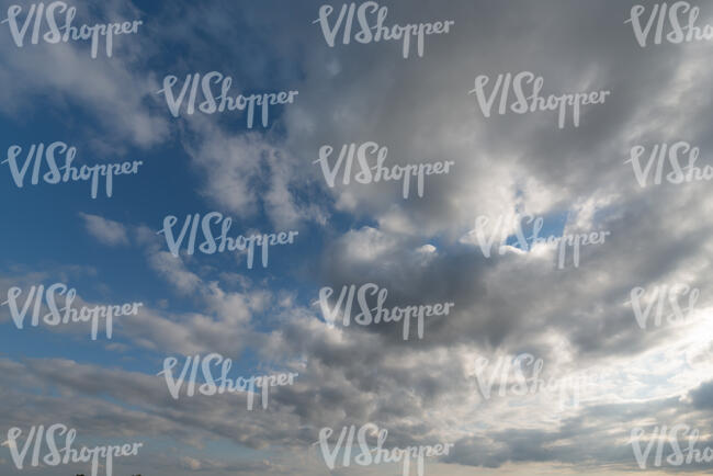 sky with many greyish cumulus clouds