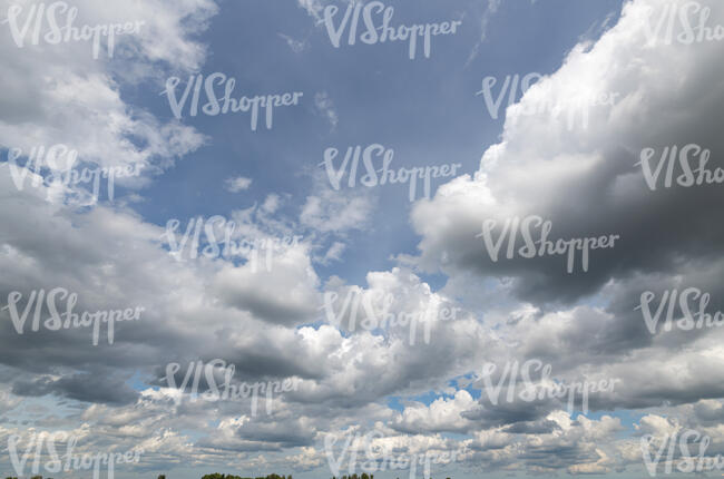 pale blue sky with slightly greyish clouds