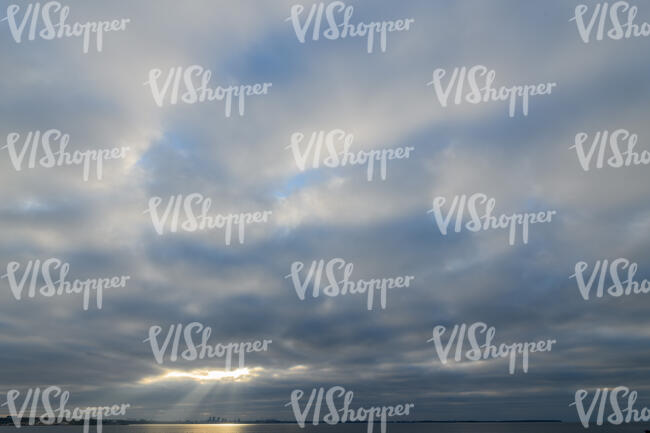 cloudy sky with rays of sunshine