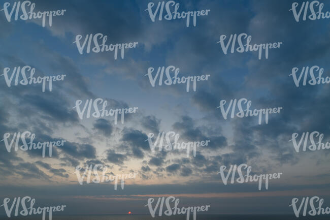 sky with sun low in the horizon