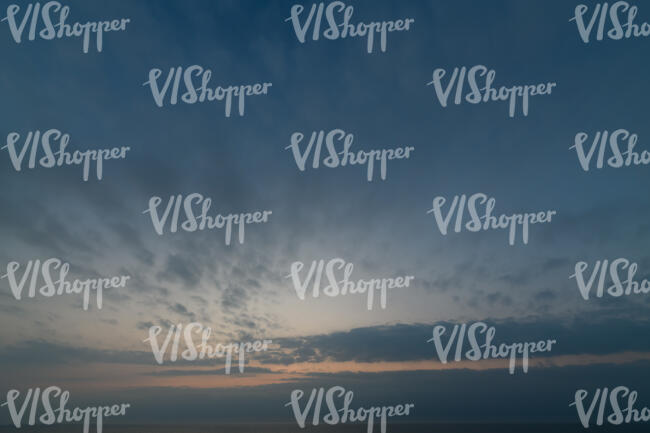 late evening sky with sun behind the horizon
