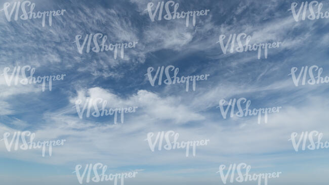 blue sky with thin white clouds
