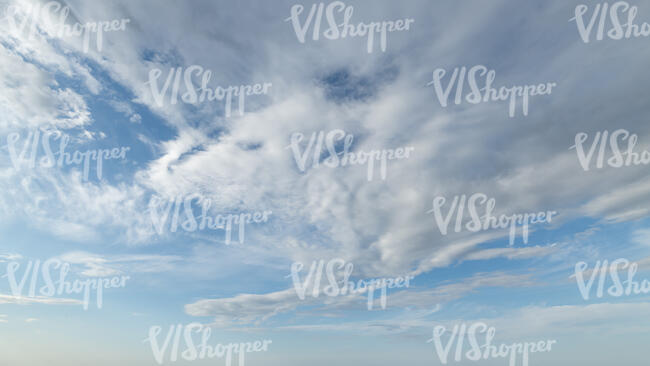 pale blue sky with clouds