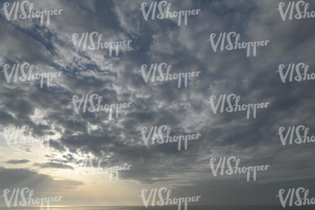 evening sky with stratus clouds and sun rays