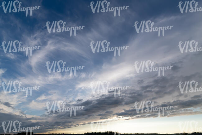 evening sky with stratus and cirrus clouds