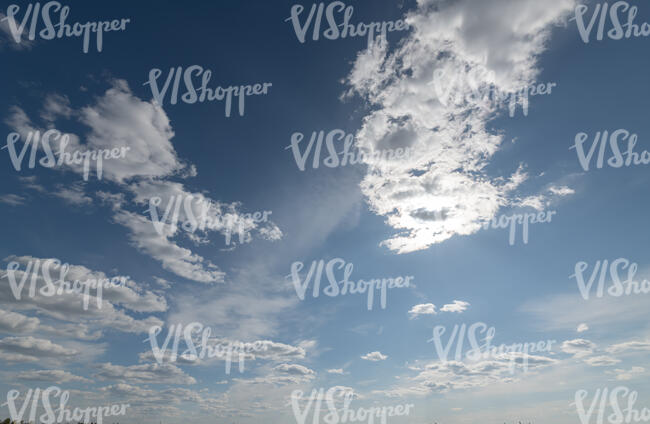 daytime sky with thin cumulus clouds