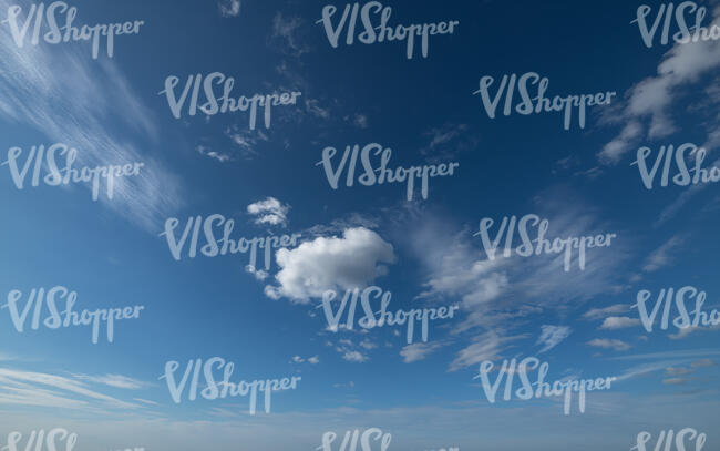blue sky with little cumulus clouds
