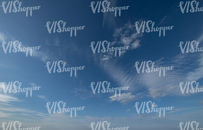 blue sky with few cirrus clouds