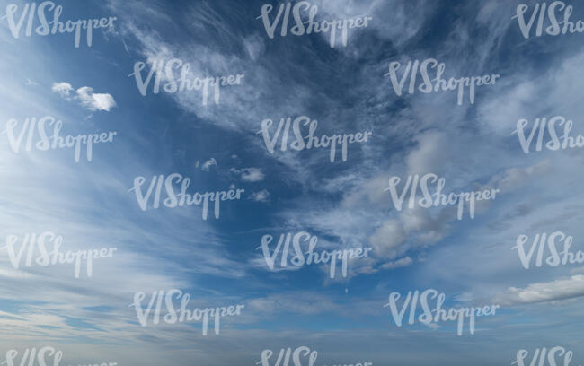 daytime sky with thin cirrus clouds