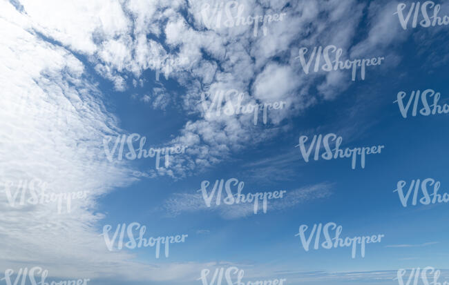daytime sky with thin white clouds
