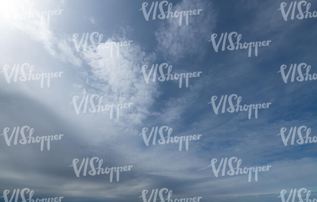 daytime sky with a thin layer of clouds