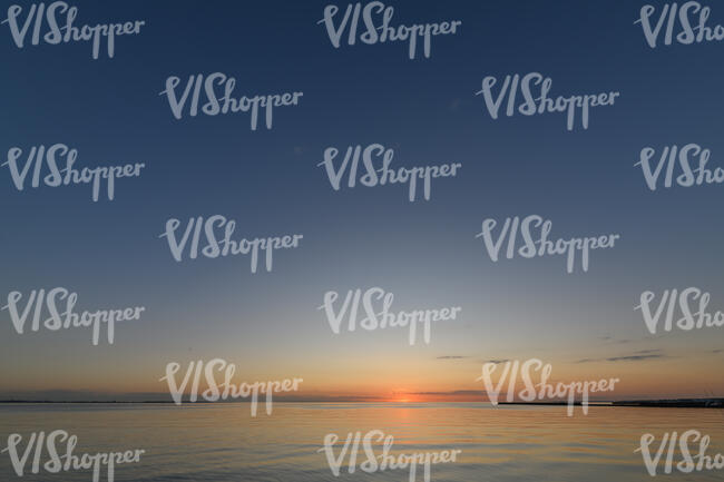 sunset with sun behind the horizon