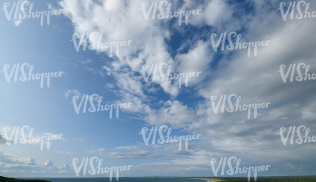 daytime sky with large cumulus clouds