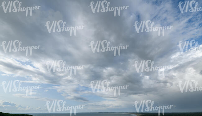 daytime sky with large cumulus clouds
