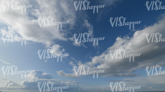 sky view with some large cumulus clouds