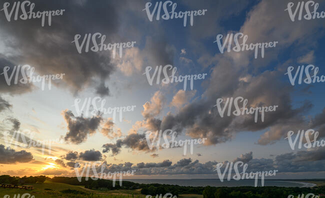 sunset with some sun shining through the clouds