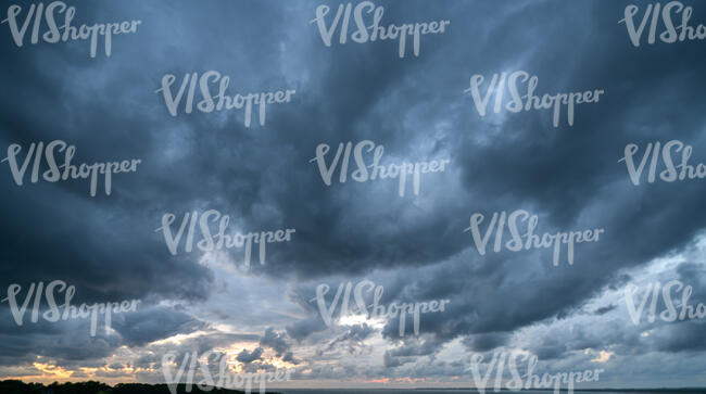 sky with dark grey clouds at dusk