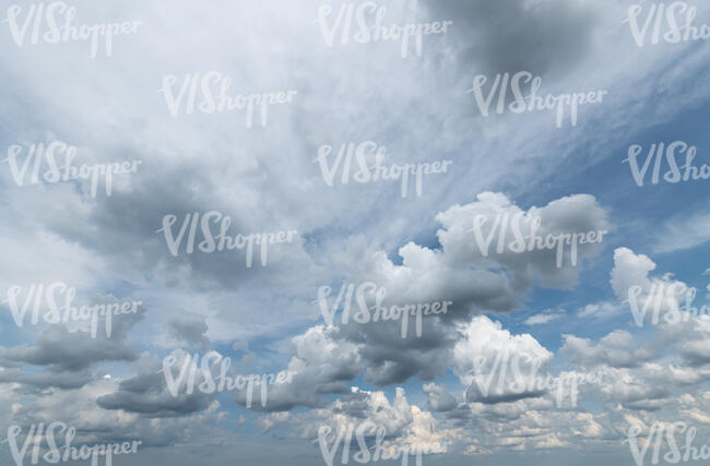 sky covered with many cumulus clouds