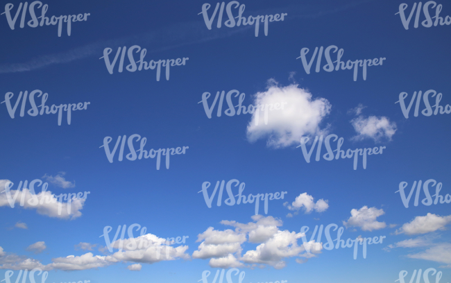 blue daytime sky with cumulus clouds