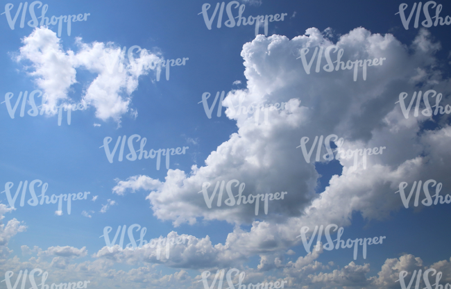 daytime sky with cumulus clouds