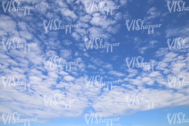 daytime sky with scattered thin clouds