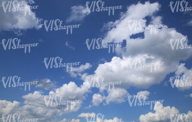 blue daytime sky with white cumulus clouds