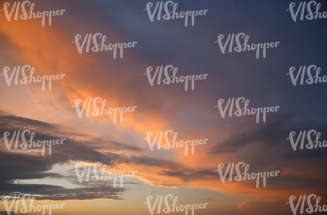 bright orange sunset sky with some clouds