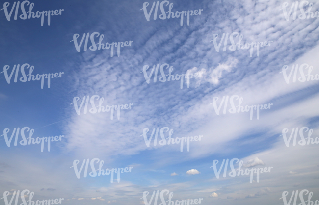 blue daytime sky with some cirrus clouds