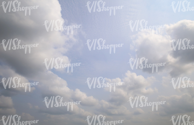 light blue sky with cumulus clouds