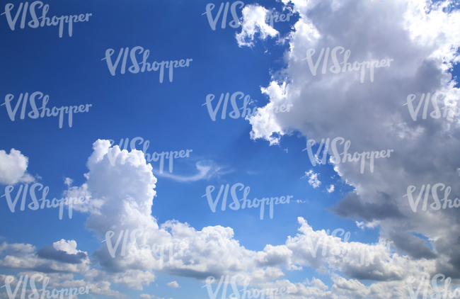 daytime sky with cumulus clouds