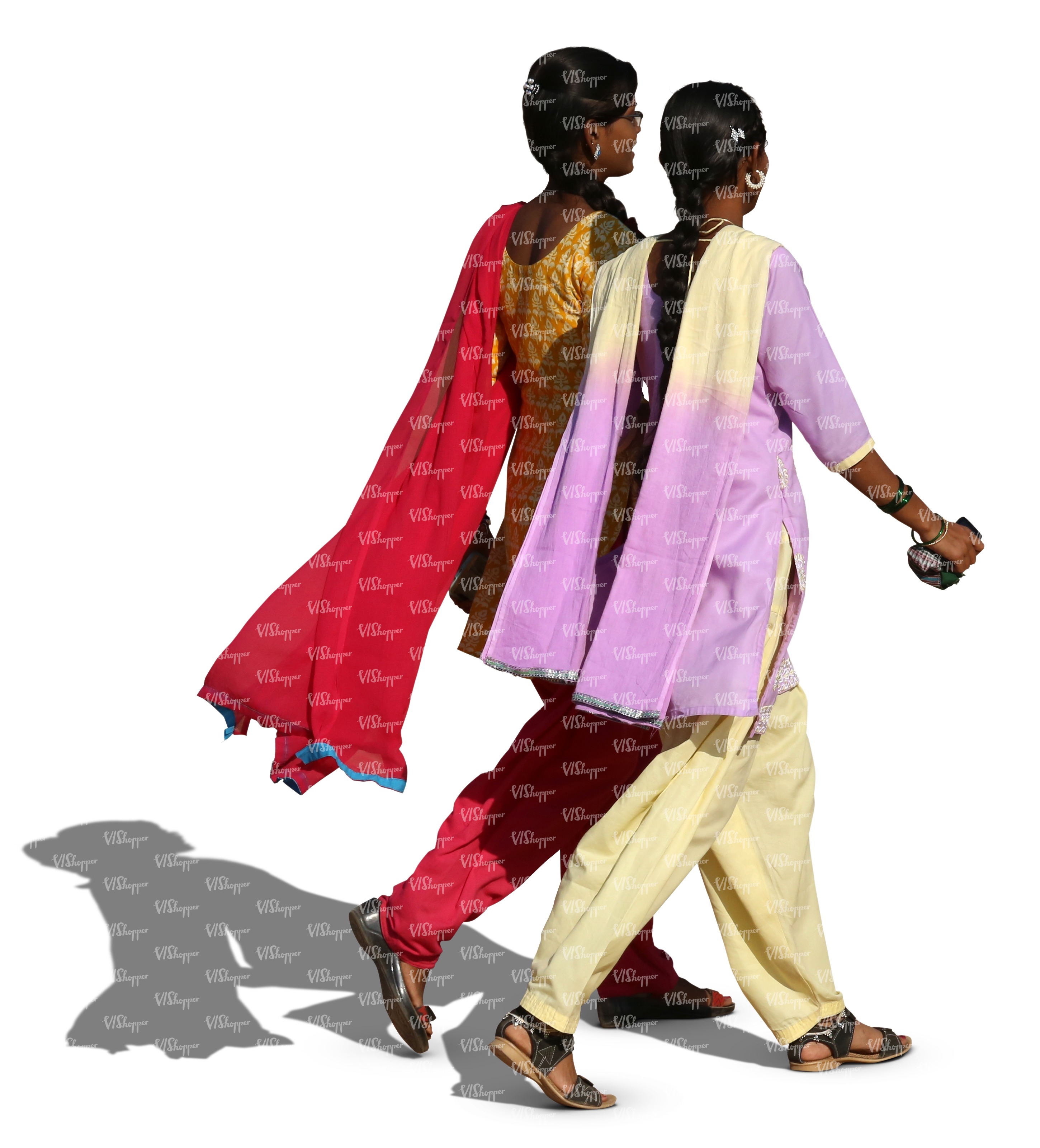 two hindu women wearing colorful indian clothing walking and